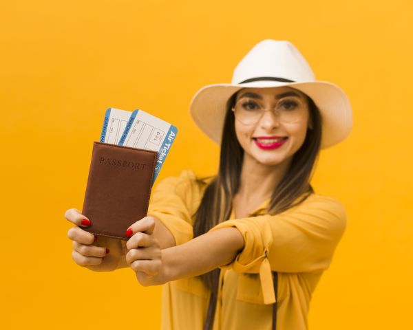 defocused-woman-holding-passport